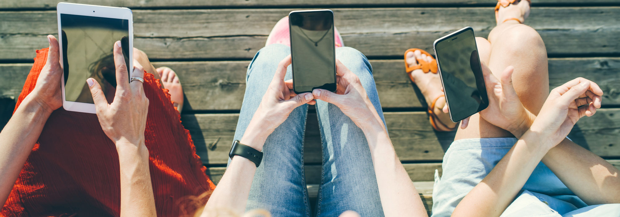 3 people with handheld devices